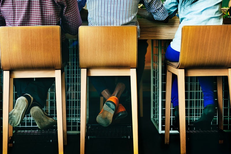 Students sitting on stools