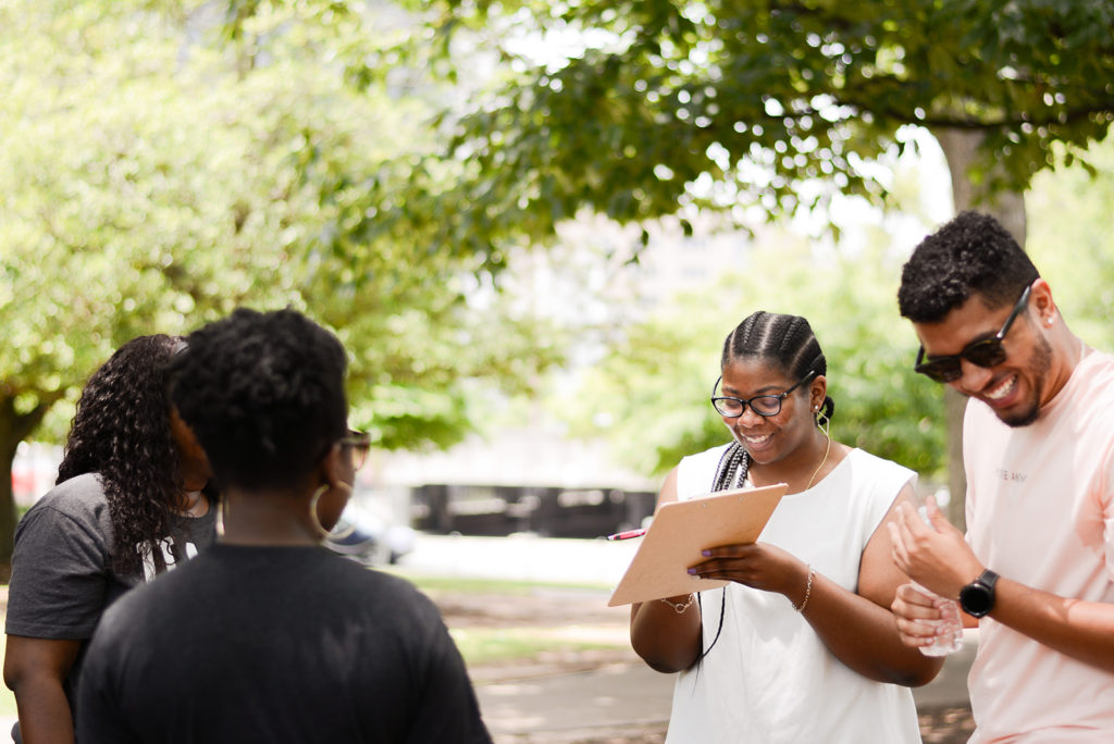 Woman Writing Name On a Paper